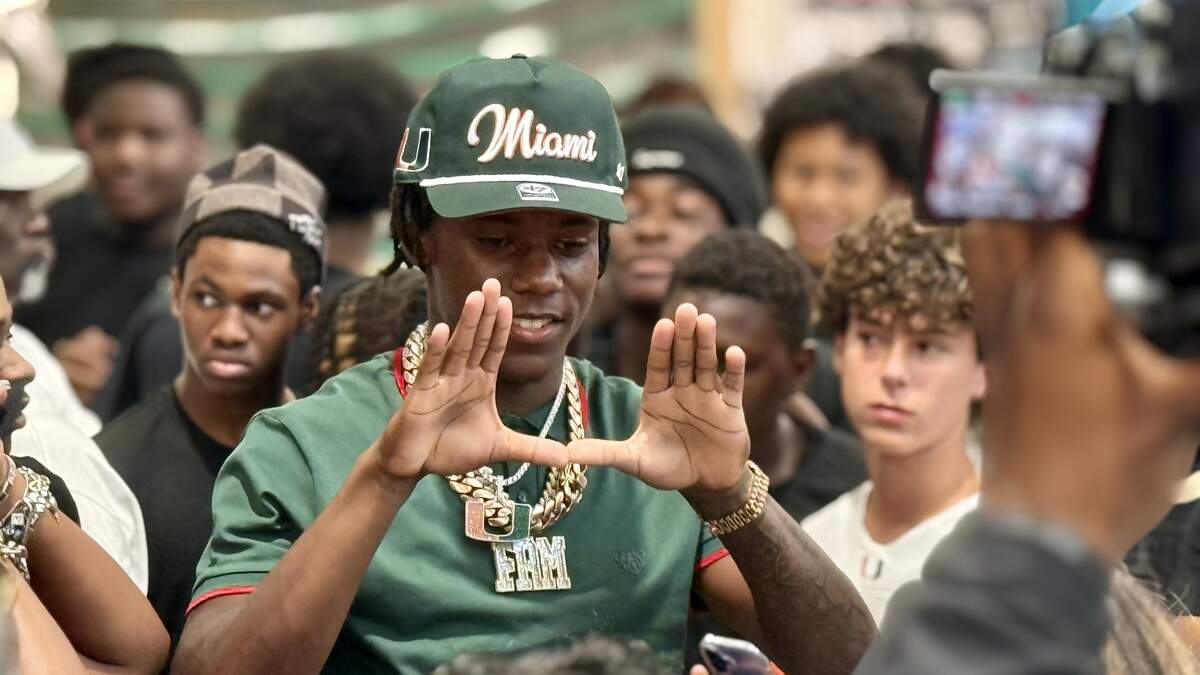 Miami Columbus two-way player A’Mir Sears throws up The U after committing to the University of Miami on Friday, July 31, 2026, at Dick’s House of Sport at Dadeland Mall in Miami, Florida. Miami Columbus two-way player A’Mir Sears throws up The U after committing to the University of Miami on Friday, July 31, 2026, at Dick’s House of Sport at Dadeland Mall in Miami, Florida.