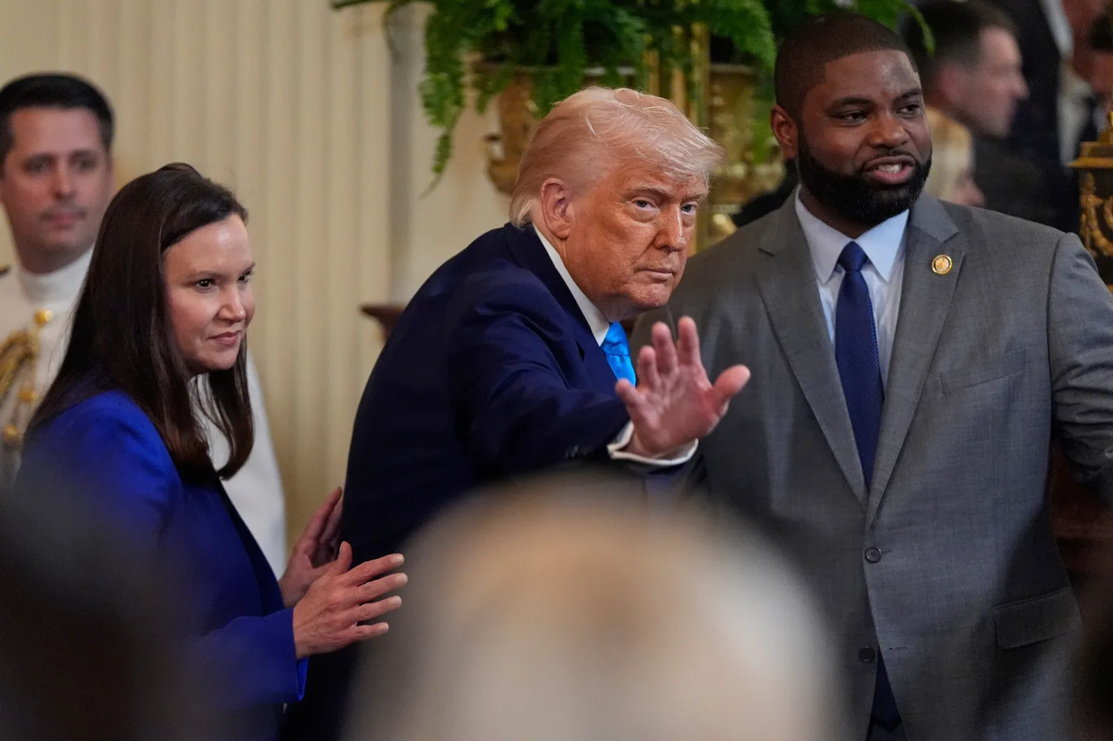 President Donald Trump departs with Sen. Ashley Moody, R-Fla., and Rep. Byron Donalds, R-Fla., after hosting the 2025 NCAA Champion, University of Florida men's basketball team in the East Room of the White House, Wednesday, May 21, 2025, in Washington. (AP Photo/Julia Demaree Nikhinson)