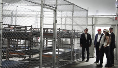 President Donald Trump, Gov. Ron DeSantis, R-Fla., and Homeland Security Secretary Kristi Noem, and others, tour "Alligator Alcatraz," a new migrant detention facility at Dade-Collier Training and Transition facility, Tuesday, July 1, 2025, in Ochopee, Fla. (AP Photo/Evan Vucci)