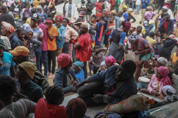 People displaced by armed gang attacks take refuge at the town hall of the Kenscoff neighborhood of Port-au-Prince, Haiti, Monday, Feb. 3, 2025. (AP Photo/Odelyn Joseph)