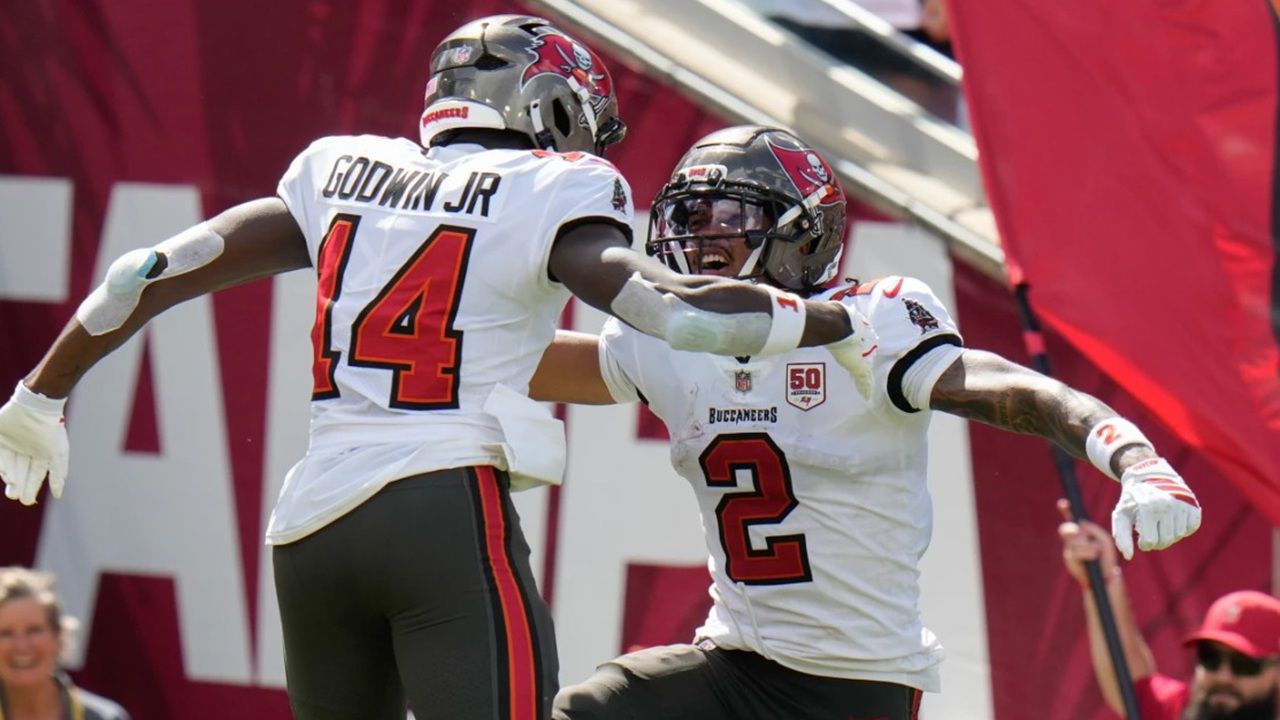 Tampa Bay wide receivers Chris Godwin, Jr. and Emeka Egbuka (2) celebrate Egbuka’s touchdown during the Bucs’ 31-25 loss against Philadelphia in Tampa on Sept. 28, 2025. (AP Photo/Chris O’Meara)