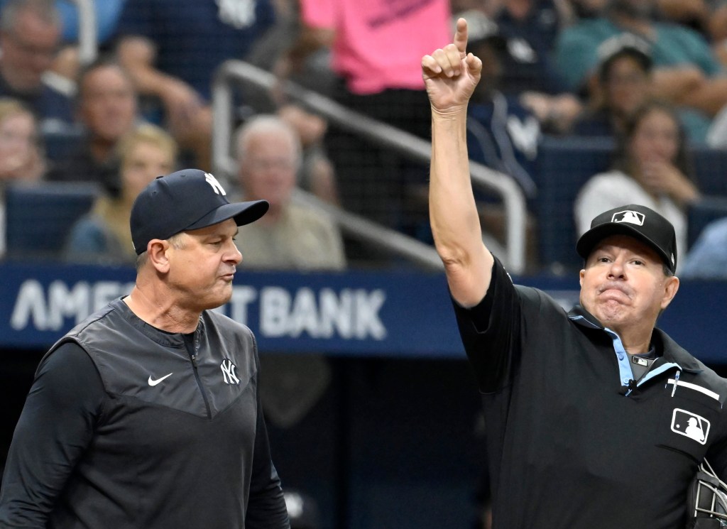 Aaron Boone (left) gets ejected by home plate umpire Doug Eddings during the sixth inning of the Yankees-Rays game on July 8, 2026 at Tropicana Field in St. Petersburg, Fla. 