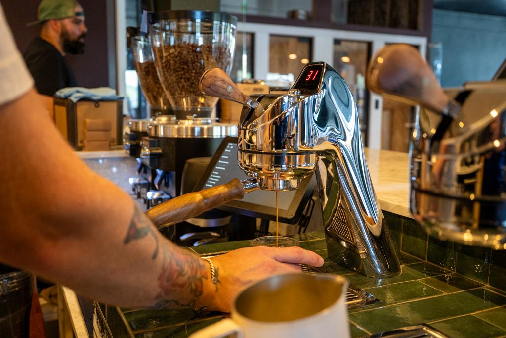 barista making coffee