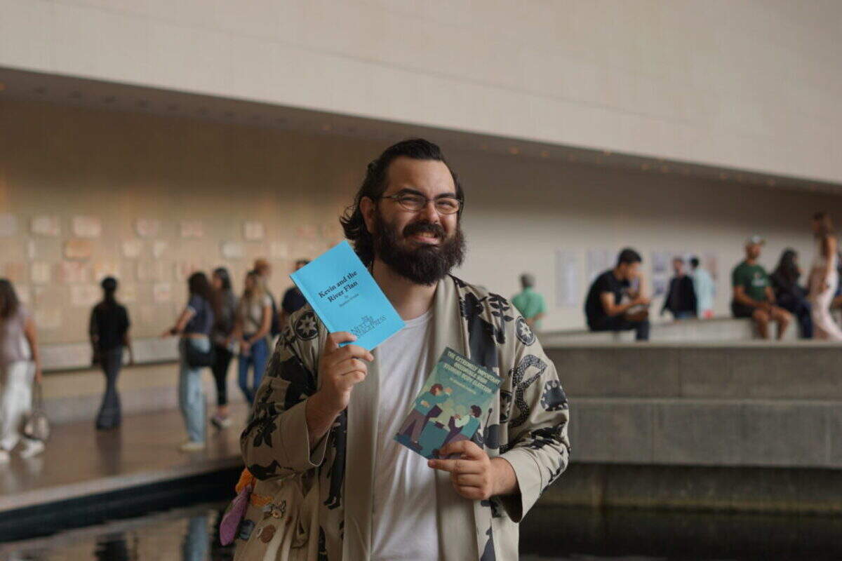 Brandon Urrutia with scripts from the company’s productions. Play publishing company 1319 Press publishes every script that LakehouseRanchDotPNG gives a world premiere.