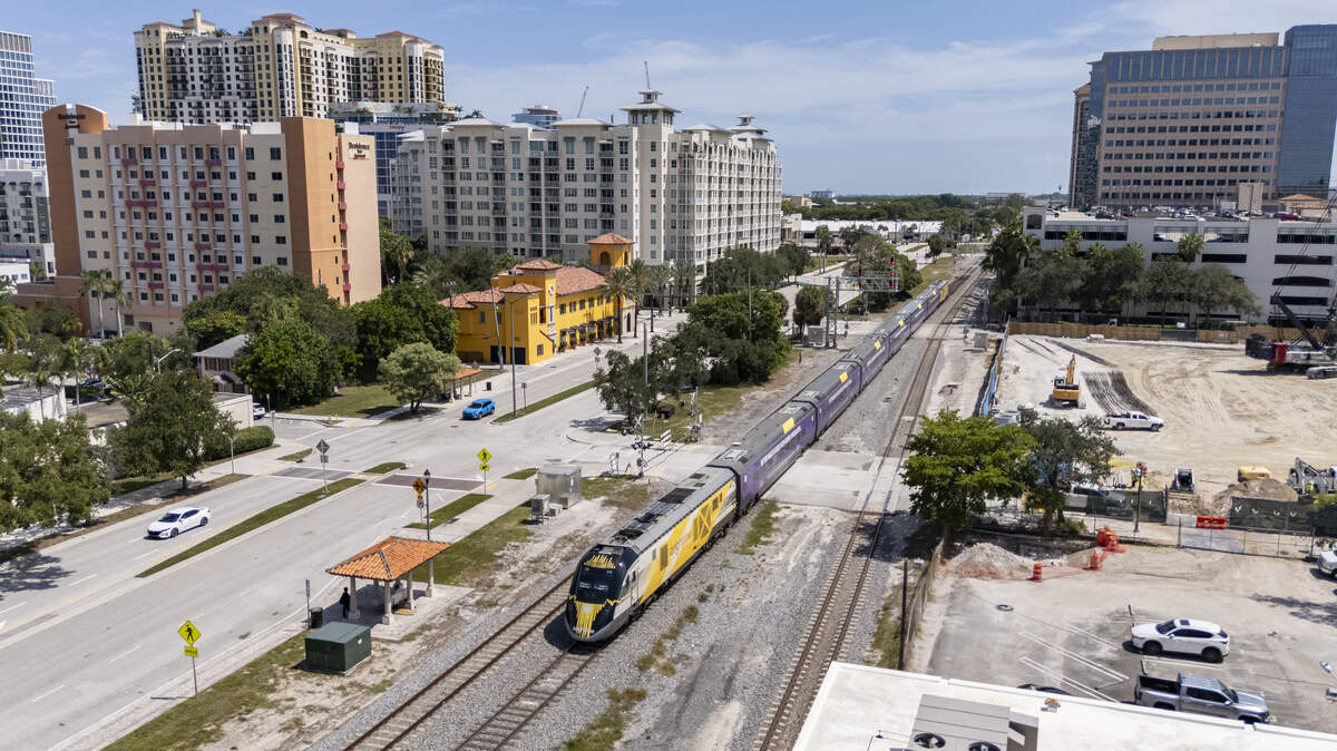 A Brightline train makes its way through West Palm Beach after departing its station on Thursday, July 31, 2025. A Brightline train makes its way through West Palm Beach after departing its station on Thursday, July 31, 2025.