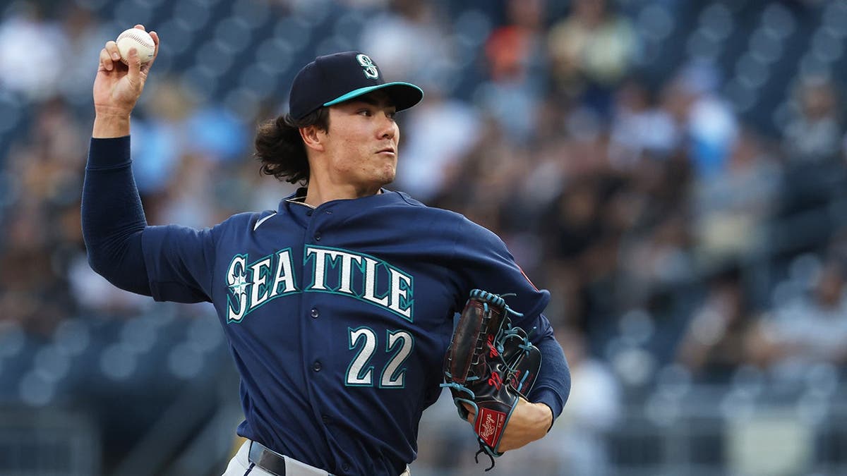 Jun 24, 2026; Pittsburgh, Pennsylvania, USA; Seattle Mariners starting pitcher Bryan Woo (22) delivers a pitch against the Pittsburgh Pirates during the first inning at PNC Park. Mandatory Credit: Charles LeClaire-Imagn Images