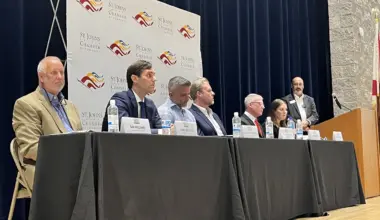 St. Johns County Commission candidates sit at a table during a candidate forum.