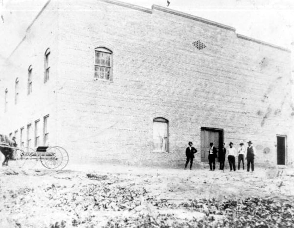 Photos from Florida Memory show workers rolling cigars inside its walls a century ago.