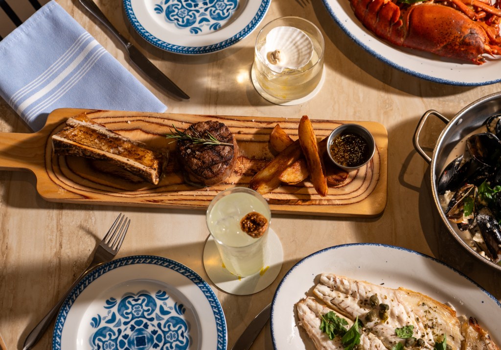 a display of Mediterranean dishes on a wood table