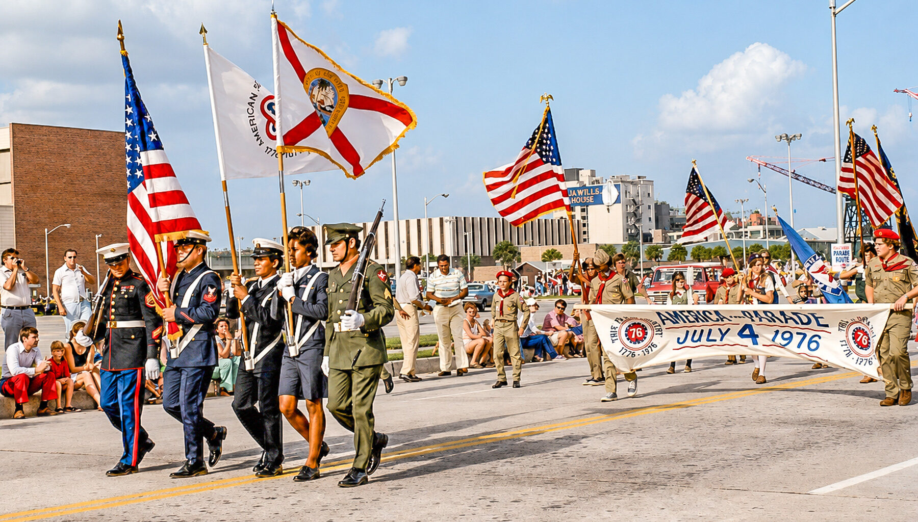 What’s a parade without its flag bearers? A solemn line-up marches down Coastline Drive in the July 4, 1976 parade.