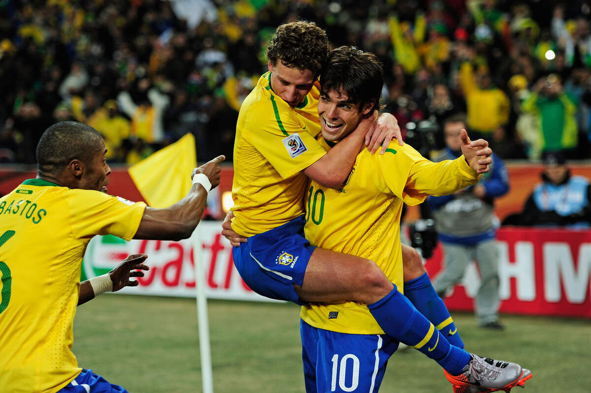 Kaká, right, celebrates with his teammates during a 2010 World Cup game in Johannesburg, South Africa.