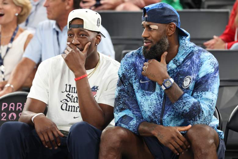 LeBron James sits with Miami Heat center Bam Adebayo during a Team USA basketball event.