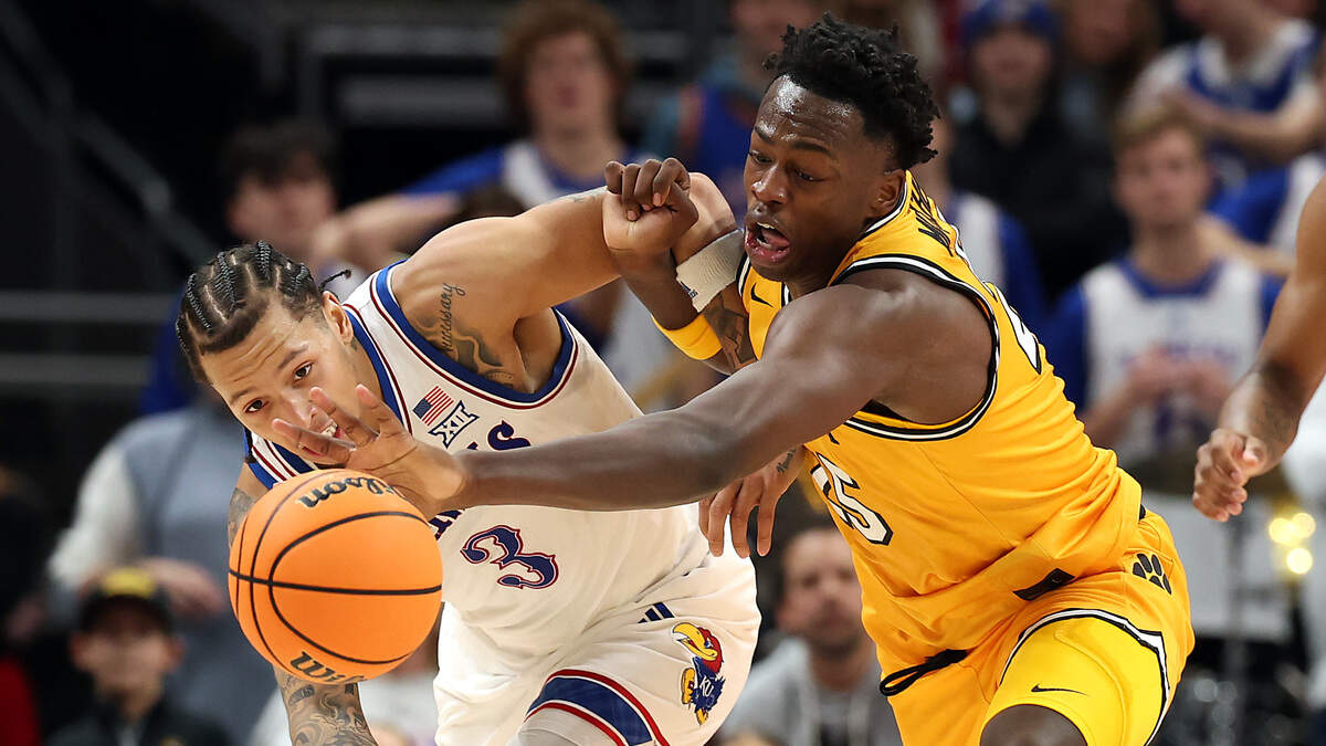 After college time with the Jayhawks Tre White (left) and at Missouri for Mark Mitchell (right), the two are competing in the 2026 Las Vegas summer league and trying to make NBA rosters. Tre White #3 of the Kansas Jayhawks and Mark Mitchell #25 of the Missouri Tigers compete for a loose ball during the first half of the game at T-Mobile Center on December 7, 2025 in Kansas City.