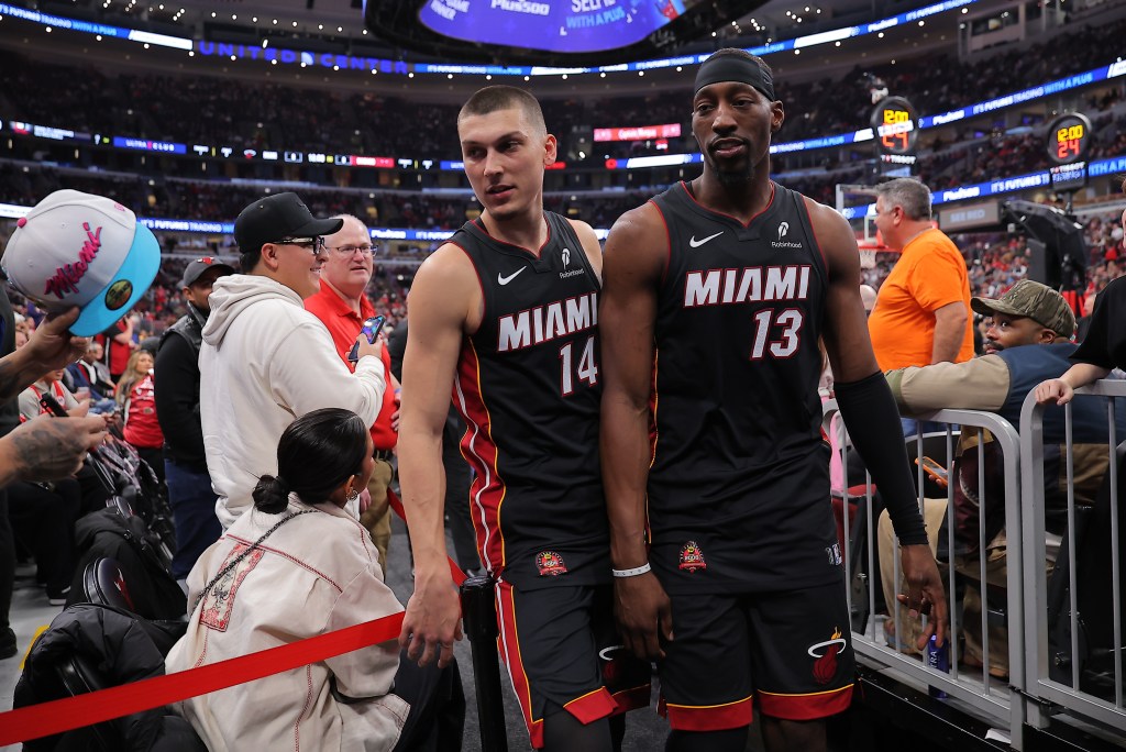 Bam Adebayo #13 of the Miami Heat and Tyler Herro #14 of the Miami Heat exit the court during a delay of a game between the Chicago Bulls game on January 8, 2026 at the United Center in Chicago, Illinois.