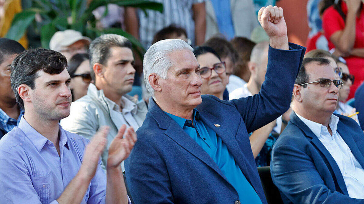 Cuba’s leader Miguel Diaz-Canel raises his fist next to Progressive International’s general coordinator, David Adler, during an event at the Cuban Institute for Friendship with the Peoples in Havana, on March 21, 2026. Cuba’s leader Miguel Diaz-Canel raises his fist next to Progressive International’s general coordinator, David Adler, during an event at the Cuban Institute for Friendship with the Peoples in Havana, on March 21, 2026.