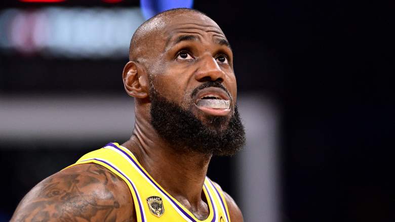 LeBron James looks upward while wearing a Los Angeles Lakers jersey during a game.