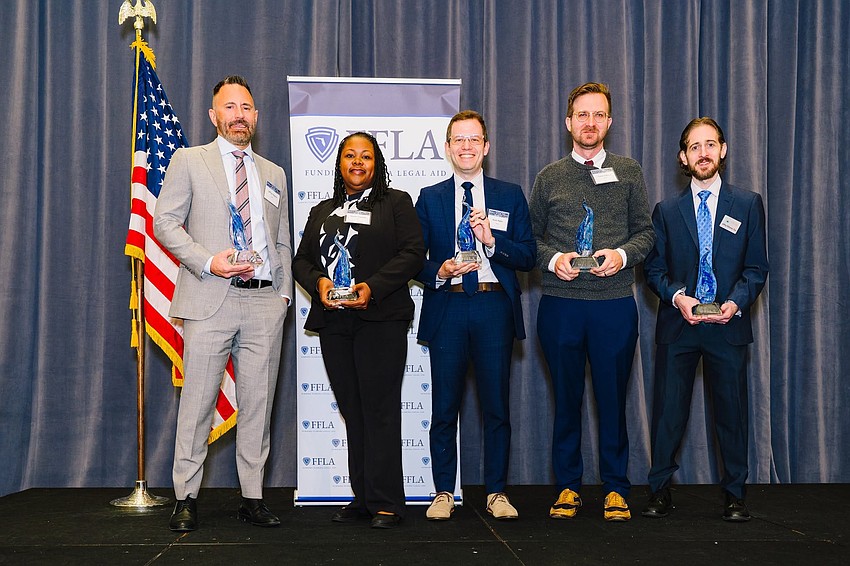 The Goldstein-Van Nortwick Award was presented to, from left, Jeff Hearne, Legal Services of Greater Miami; Natalie Maxwell, National Housing Law Project; Kevin Rabin, Three Rivers Legal Services; Daniel Clibbon, Legal Services of North Florida; and Jeff Hittleman, Coast to Coast Legal Aid. The Goldstein-Van Nortwick Award was presented to, from left, Jeff Hearne, Legal Services of Greater Miami; Natalie Maxwell, National Housing Law Project; Kevin Rabin, Three Rivers Legal Services; Daniel Clibbon, Legal Services of North Florida; and Jeff Hittleman, Coast to Coast Legal Aid.