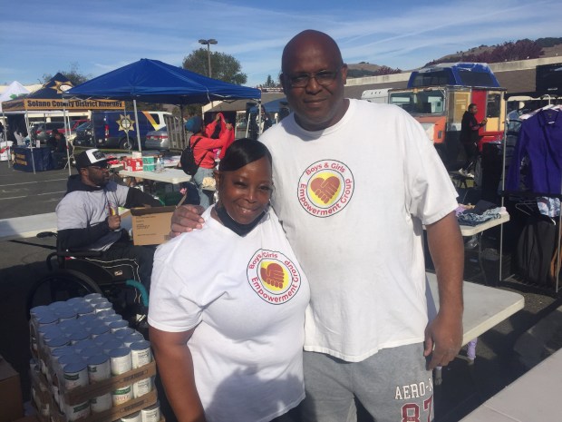 Sherry Kelly and Orlando Graham of Boys & Girls Empowerment Group help out at the Health Fair in North Vallejo in 2022. (Thomas Gase - Times-Herald)