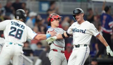 The Marlins' Griffin Conine (right) celebrates with Kyle Stowers after hitting a two-run home run to take an 8-6 lead on the Phillies in the eighth inning on Wednesday in Miami.