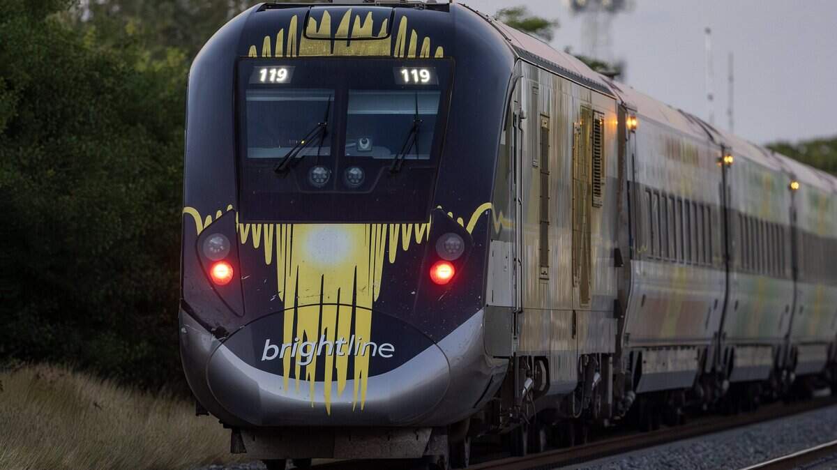 A Brightline train rests on the northbound track after colliding with a vehicle near the 14100 block of Biscayne Boulevard in Miami on Wednesday, Nov. 19, 2025. One person was airlifted to a trauma center.
