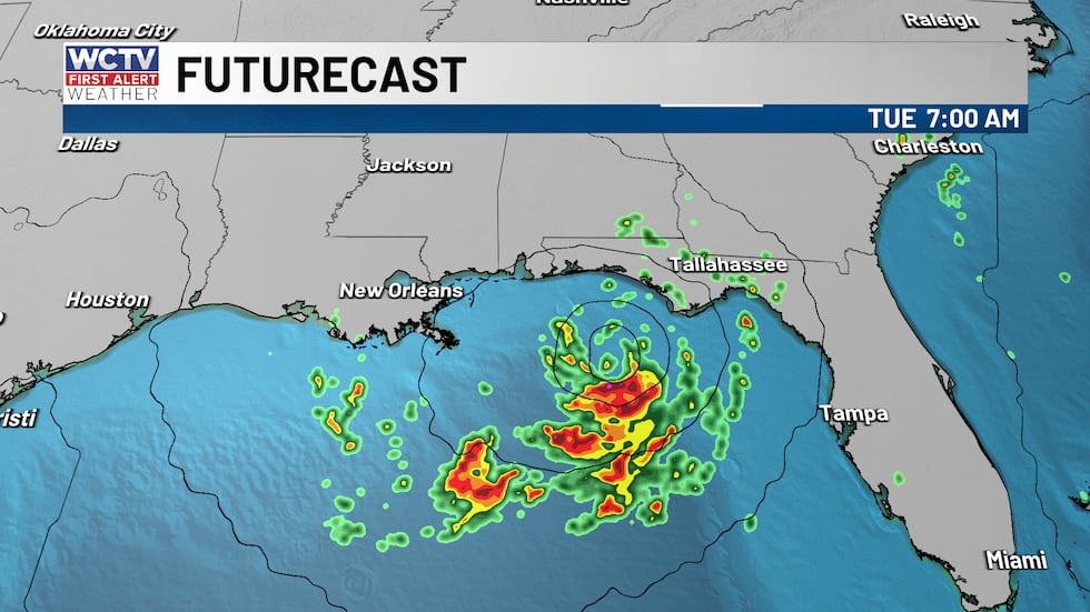 91L passes by our south bringing outer bands to the area on Tuesday as it drifts west.