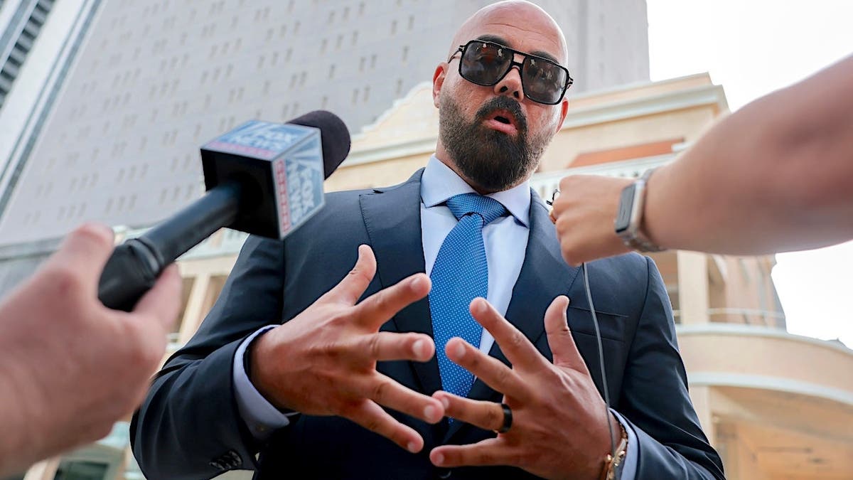 Joseph McBride speaks to reporters outside a courthouse in Miami, Florida.
