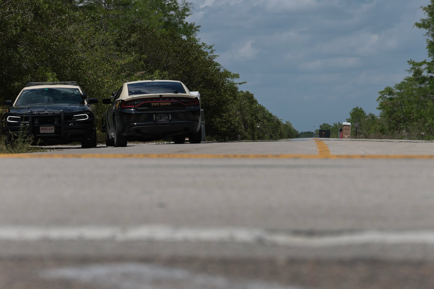 Florida Highway Patrol vehicles, seen at the front entrance to the immigration detention center in the Florida Everglades known as “Alligator Alcatraz” on April 22.