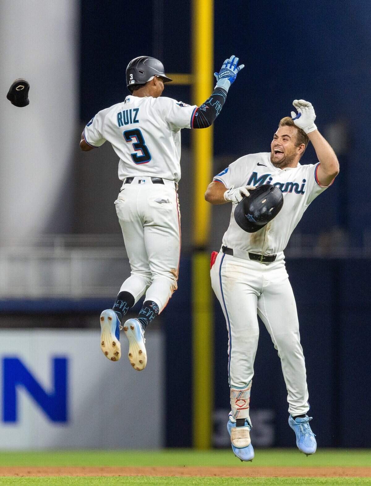 Miami Marlins center fielder Jakob Marsee (87) and Miami Marlins right fielder Esteury Ruiz (3), left, celebrate after Marsee hit a walk off single winning the game for the Miami Marlins in the tenth inning of their MLB game against the Seattle Mariners at loanDepot park on Tuesday, July 7, 2026, in Miami, Fla.