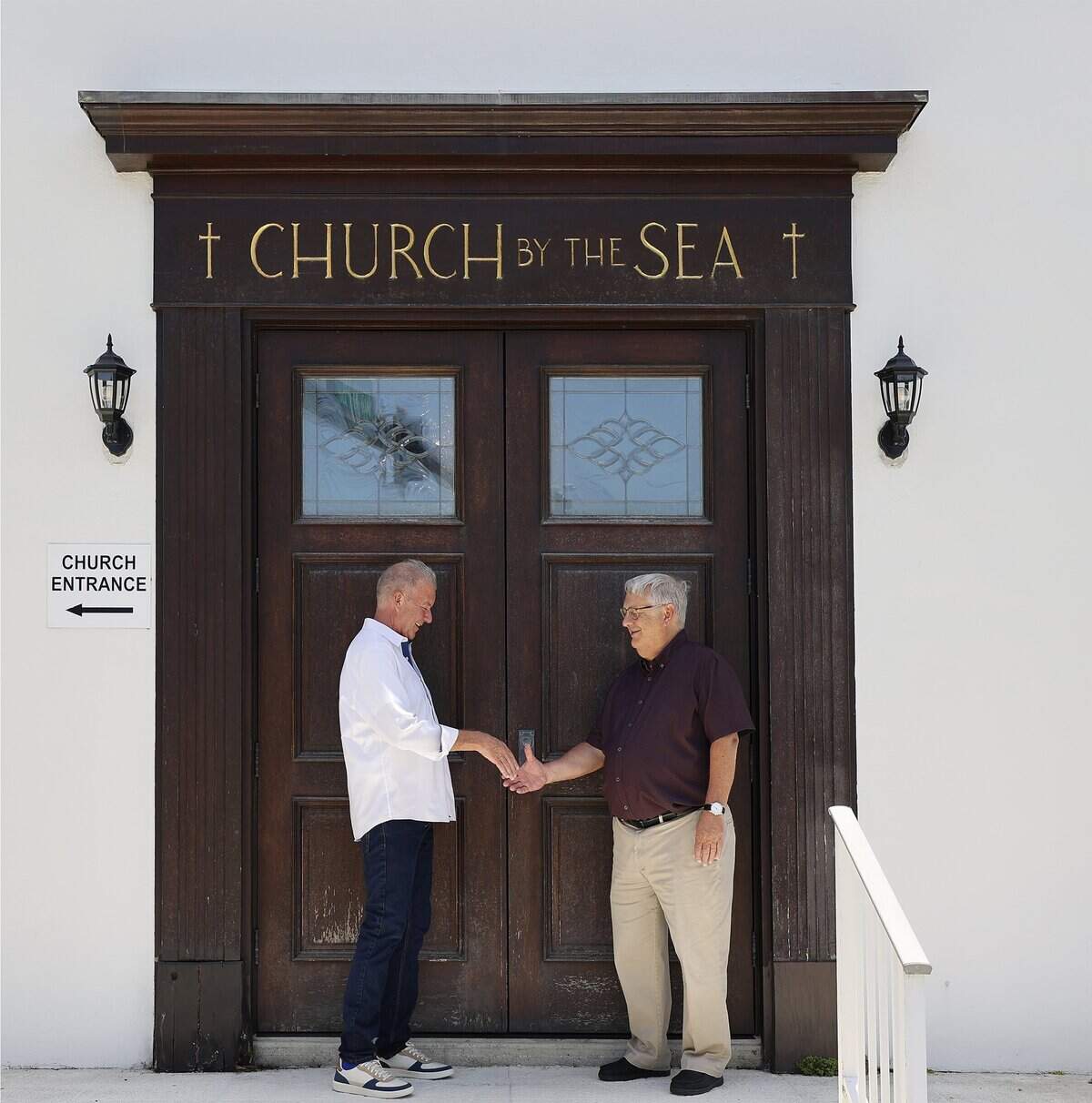 Church By The Sea treasurer Harry Rozelle, left, and senior pastor Brian Checchio, are close to reaching their fundraising goal for a new living seawall, Tuesday, July 15, 2026, in Fort Lauderdale, Fla.