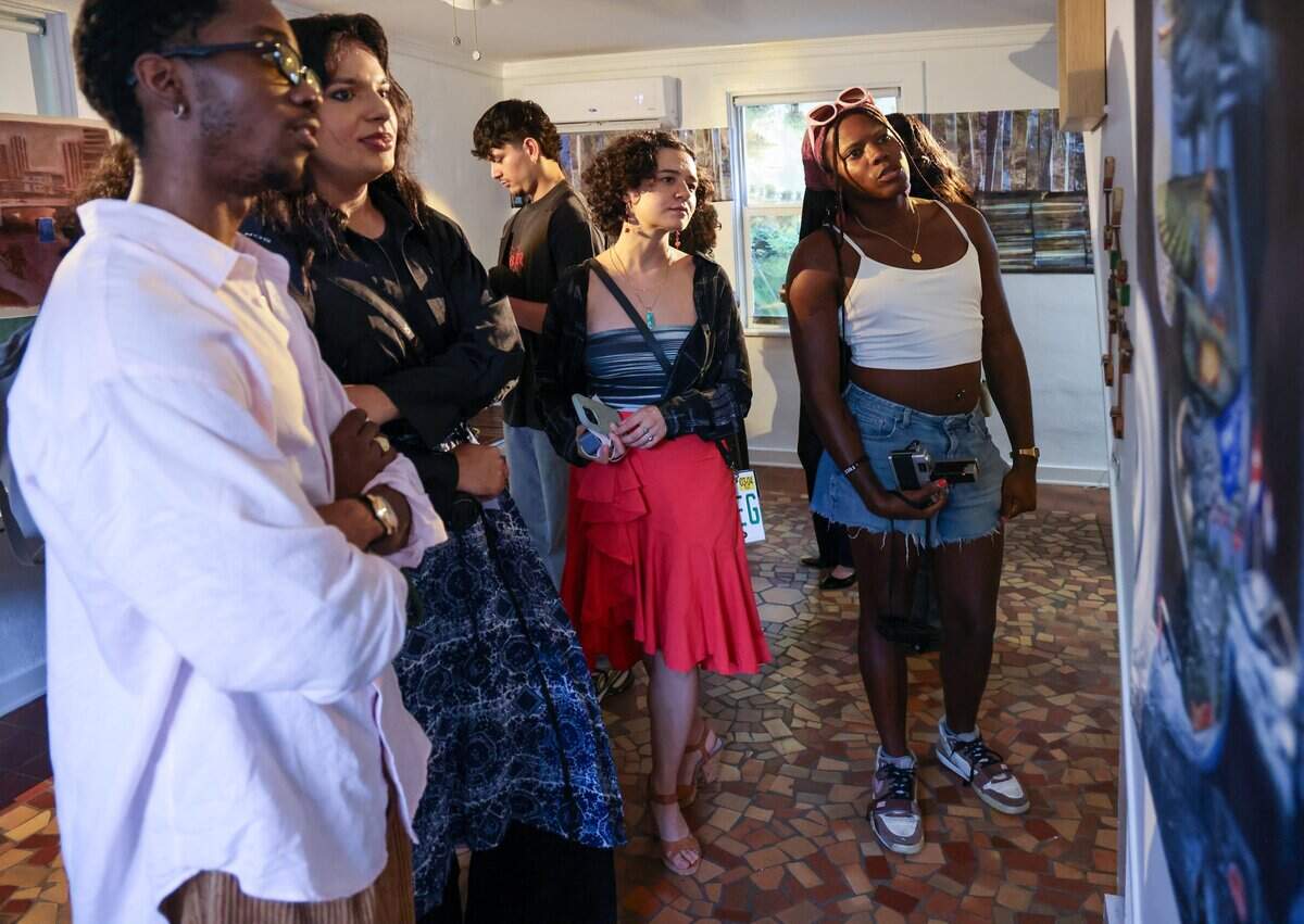 Attendees and artists explore the 100-year-old home, engaging with various art installations, as curators Sophia Corugedo and Sofia Villalonga host a farewell event for the historic house, which is scheduled for demolition, on Monday, July 13, 2026, in Miami. Friends - Sophia Corugedo, and Sofia Villalonga, hosted the Turn of a Century event at the 100-year-old home, which is slated for demolition after being sold to a developer. The gathering features artists, performers and dancers saying farewell to the house before the owners move out by July 15.