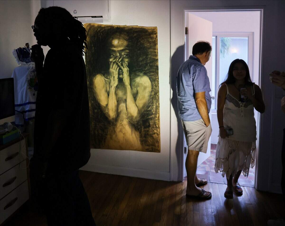 Attendees and artists explore the 100-year-old home, engaging with various art installations, as curators Sophia Corugedo and Sofia Villalonga host a farewell event for the historic house, which is scheduled for demolition, on Monday, July 13, 2026, in Miami. Friends - Sophia Corugedo, and Sofia Villalonga, hosted the Turn of a Century event at the 100-year-old home, which is slated for demolition after being sold to a developer. The gathering features artists, performers and dancers saying farewell to the house before the owners move out by July 15.