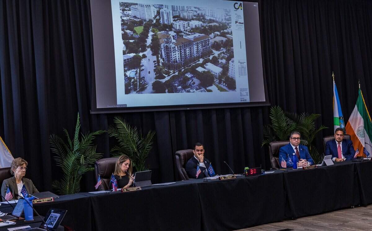 Members of the Coral Gables Commission and the Mayor listened to speakers during a meeting to discuss items related to the site located 110 Phonetia Avenue, in the Douglas Section in Coral Gables, home of the St. James Evangelical Lutheran Church of Coral Gables and the Crystal Academy, bought by the Century Homebuilders Group in 2021 and sold to Chicago-based Fifield Companies, with plans to develop a project called Crystal, a 9-story mixed-use building, on Tuesday, July 07, 2026.