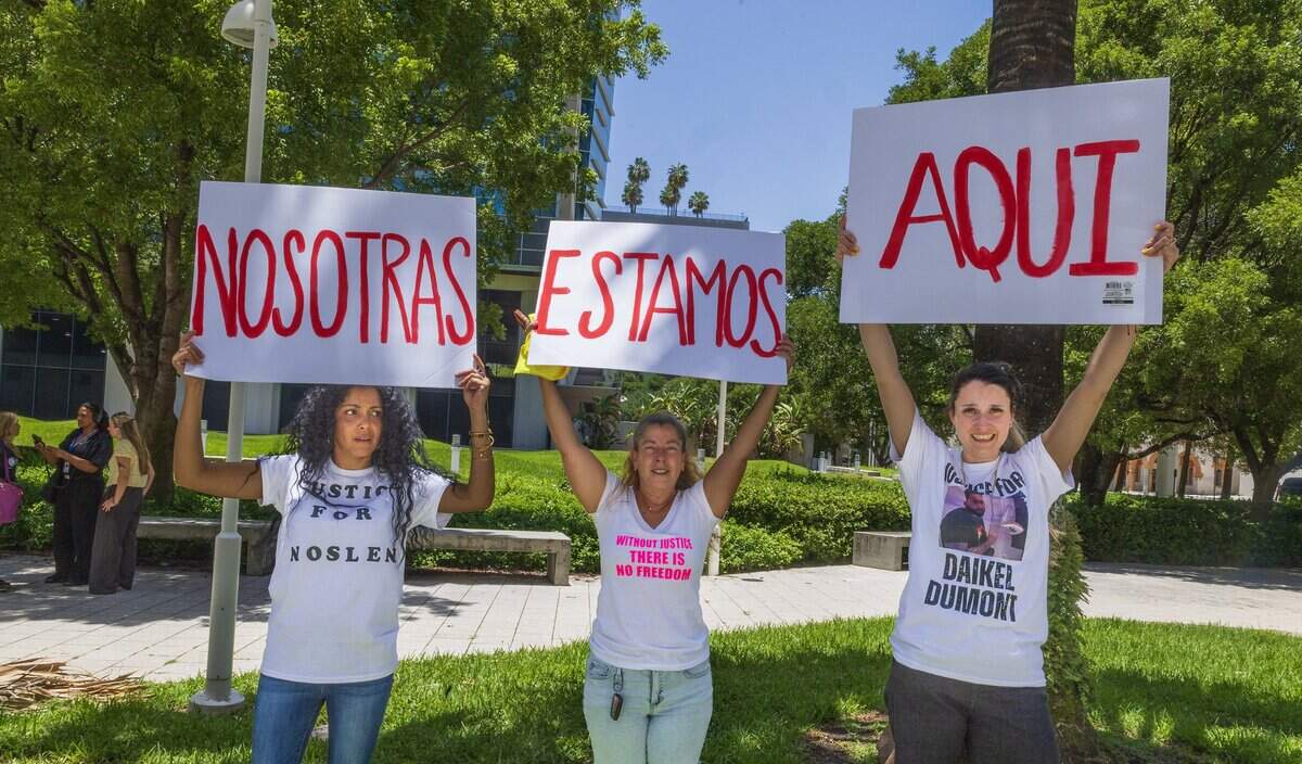 from left- Anisley Cortez, Judith Castellanos and Annett Dumont, the wives of Cuban migrants Noslen Cendra Gonzalez, Marlon Cervelo Trujillo and Daikel Dumont respectively, attended a press conference in front of the Federal Detention Center (FDC) in Downtown Miami where they are detained, to ask for them to be release, on Wednesday July 15, 2026.