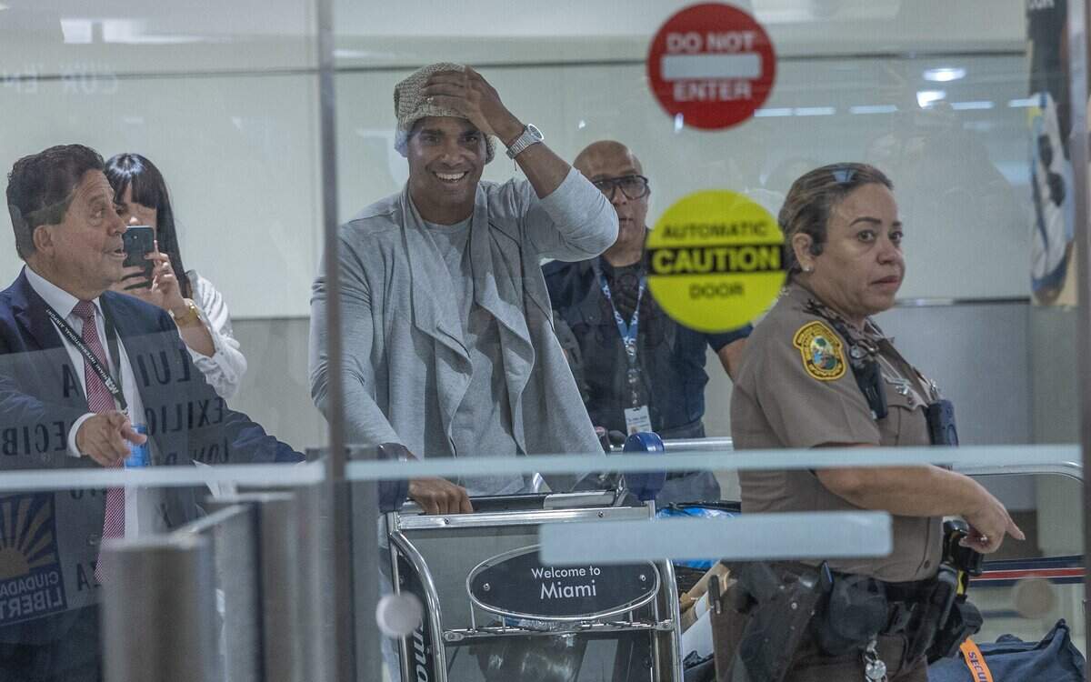 Cuban dissident artist Luis Manuel Otero Alcántara reacts as he arrives at Miami International Airport. He was released from a five-year prison sentence on the condition that he leave his country to exile on Saturday, July 18, 2026.