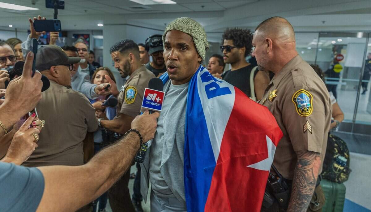 Cuban dissident artist Luis Manuel Otero Alcántara talks to the media after arriving at Miami International Airport on Saturday, July 18, 2026.