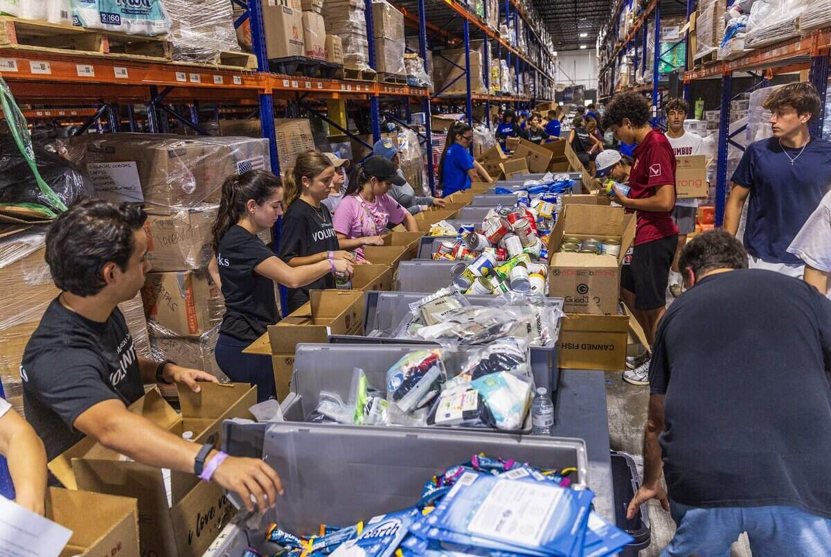 Volunteers filled boxes with supplies of aid for the victims in Venezuela following the earthquakes, as a press conference held by Michael Capponi, Global Empowerment Mission (GEM), was taking place to announce the long time commitment the plans for GEM to settle permanently in La Guaira, at the organization's headquarters in Doral, on Friday July 17, 2026.