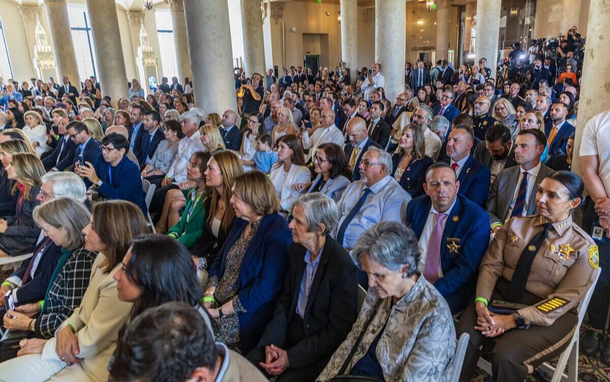 A large group of Cuban American listens as acting Attorney General Todd Blanche, announces, a federal indictment against Raúl Castro for the shoot-down of two Brothers to the Rescue planes in 1996, during an event to honor the victims of that tragic event, celebrated at the iconic Freedom Tower, in Miami, on Wednesday, May 20, 2026.