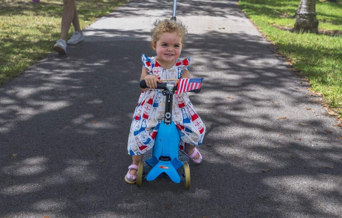 Little Desiree, 1 y.o. waves an American flag attended the 67th annual Key Biscayne Fourth of July parade celebrating the America's 250th and the 35th anniversary of the Village's birth as its own municipality, on Saturday, July 04, 2026.