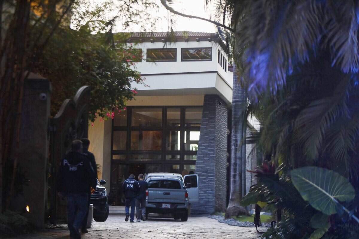 Federal agents outside 2 Star Island Island Drive,  owned by Sean ‘Diddy’ Combs on Monday, March 25, 2024, in Miami Beach, Florida. The raid followed a suit by his ex producer alleging Diddy was engaged in a ‘widespread and dangerous criminal sex trafficking organization
