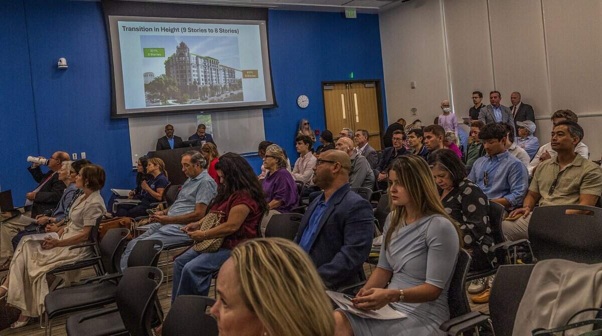 View of attendees to the City of Coral Gables commission meeting to discuss items related to the site located 110 Phonetia Avenue, in the Douglas Section in Coral Gables, home of the St. James Evangelical Lutheran Church of Coral Gables and the Crystal Academy, bought by the Century Homebuilders Group in 2021 and sold to Chicago-based Fifield Companies, with plans to develop a project called Crystal, a 9-story mixed-use building,  on Tuesday, July 07, 2026.