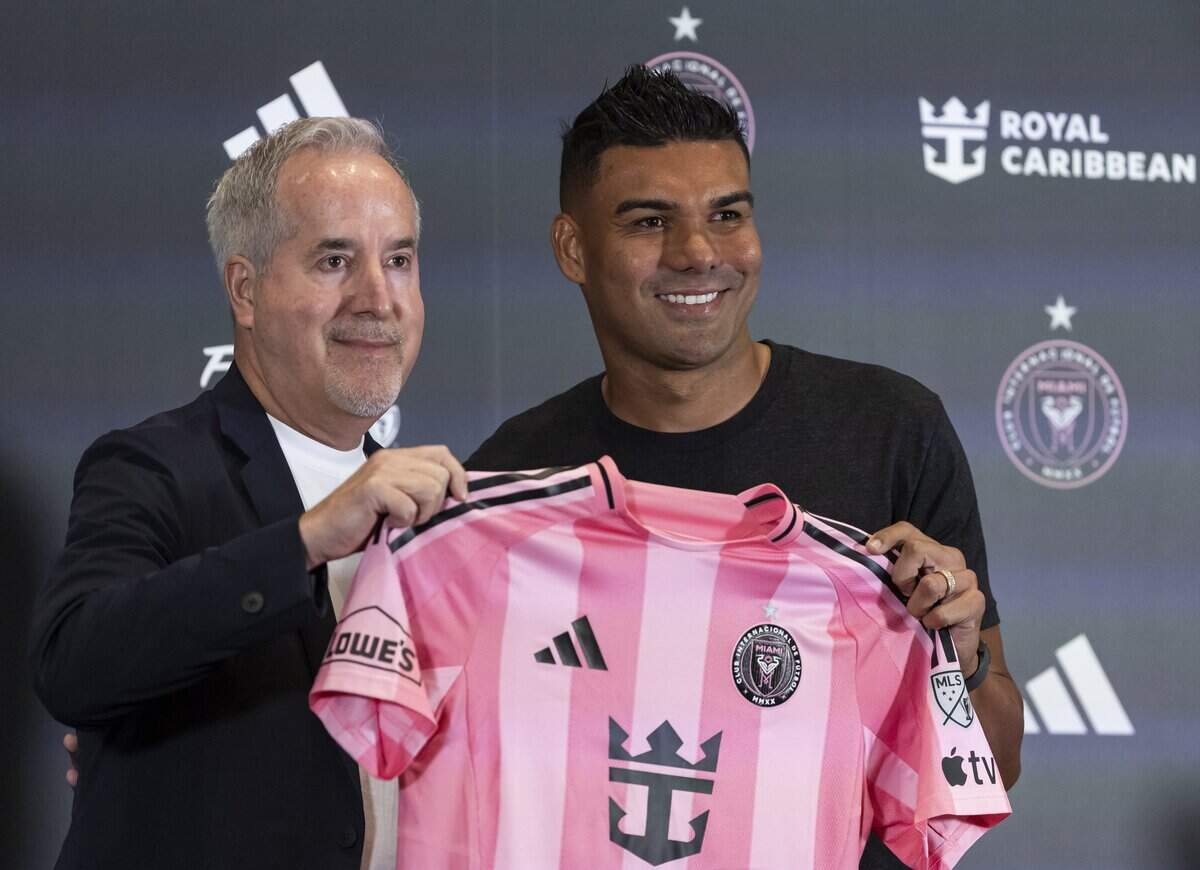 Inter Miami managing owner Jorge Mas and midfielder Casemiro (5) hold a jersey during Casemiro's introductory press conference at Nu Stadium on Thursday, July 30, 2026, in Miami, Fla.