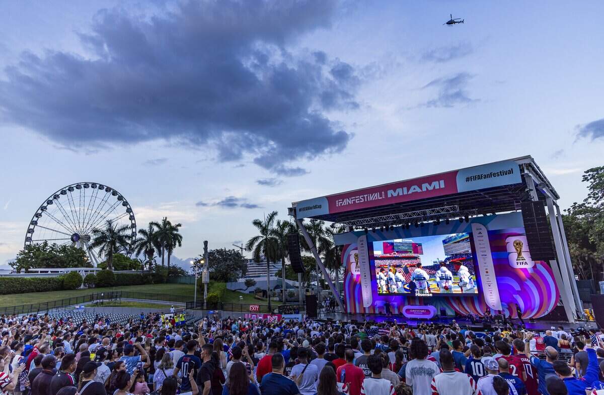 People gather at the FIFA Fan Festival 2026 in Bayfront Park to watch the United States play against Bosnia and Herzegovina on Wednesday, July 1, 2026, in downtown Miami, Fla. The United States defeated Bosnia and Herzegovina 2-0 in their FIFA World Cup Round of 32 soccer match in Santa Clara, Calif.