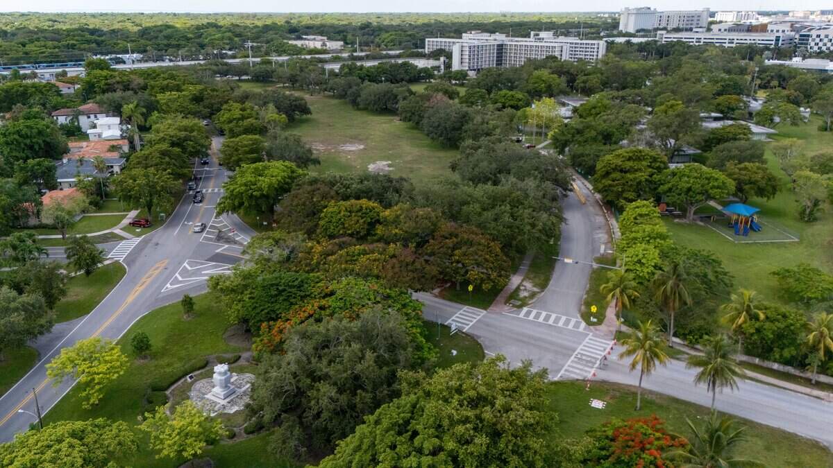 An aerial view of the green grassy area across from Henry S. West Laboratory School at 5300 Carillo Street in Coral Gables, Florida on Tuesday, June 30, 2026.The future Centennial Park owned by the University of Miami, is gifting the land to the city as part of a new development agreement.