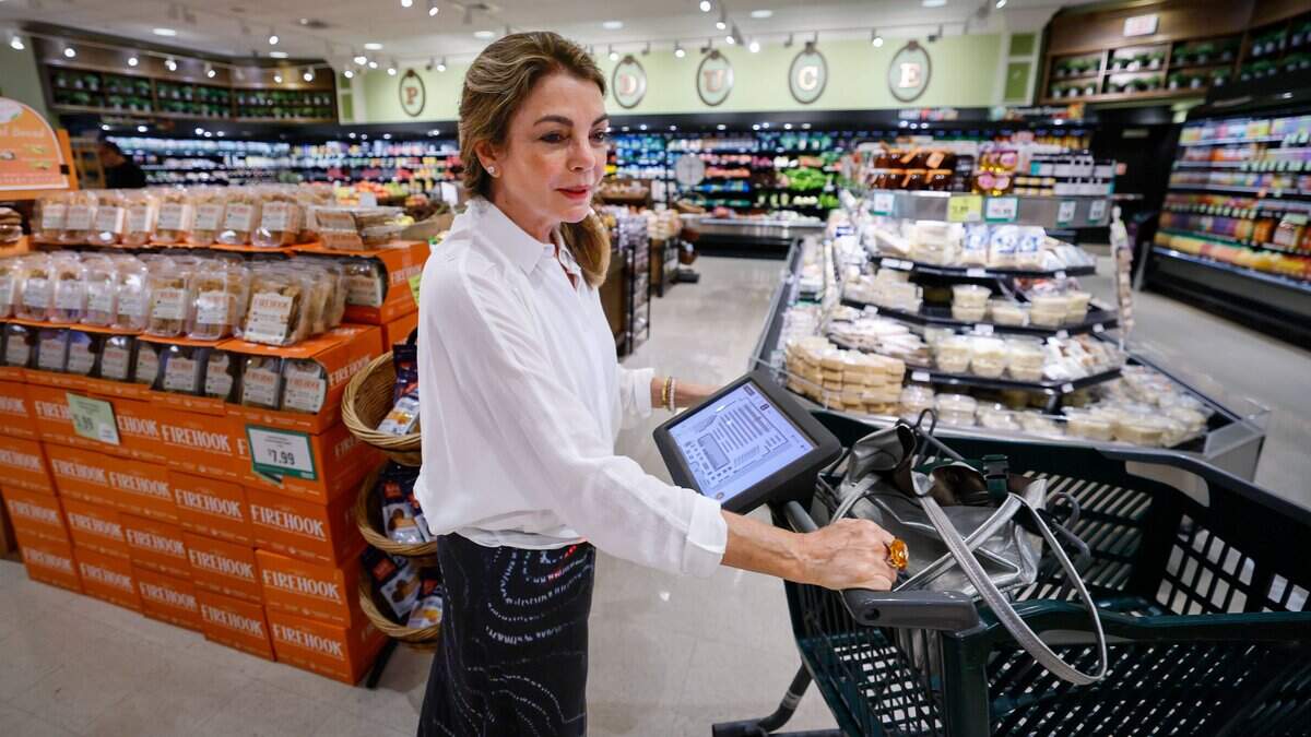 Customer Marcela Ash uses Coupr, a smart cart screen used for personalized supermarket shopping. The device and app is installed on carts at Milam's Market in Pinecrest, Florida on Wednesday, July 8, 2026,