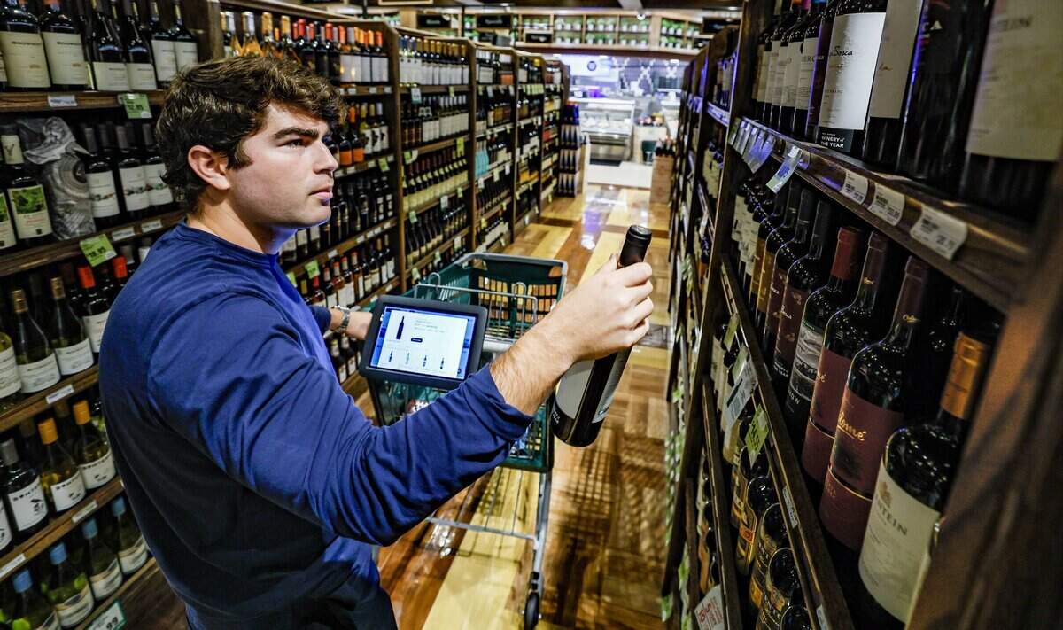 Customer Rod Barco grocery shops while using Coupr, a smart cart screen used for personalized supermarket shopping. The device and app is installed on carts at Milam's Market in Pinecrest, Florida on Wednesday, July 8, 2026,