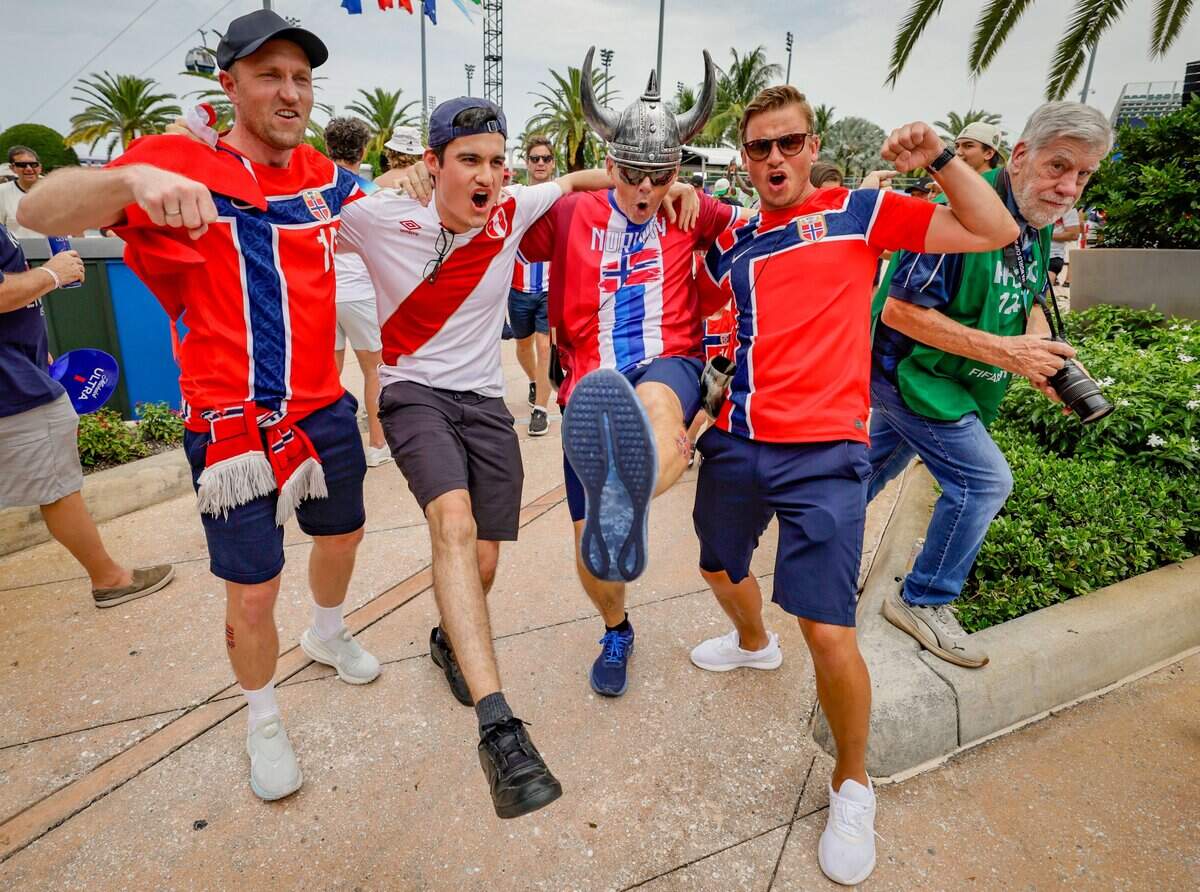 Soccer fans Peter Ohren, Lucas Pastor, Nils Rasmussen, and Simen Toensberg, seen left to right, do the row chant before the match betwween Norway and England for the FIFA World Cup 2026 Quarter Final soccer match at Hard Rock Stadium (Miami Stadium) on Saturday, July 11, 2026 in Miami Gardens, Fla.
