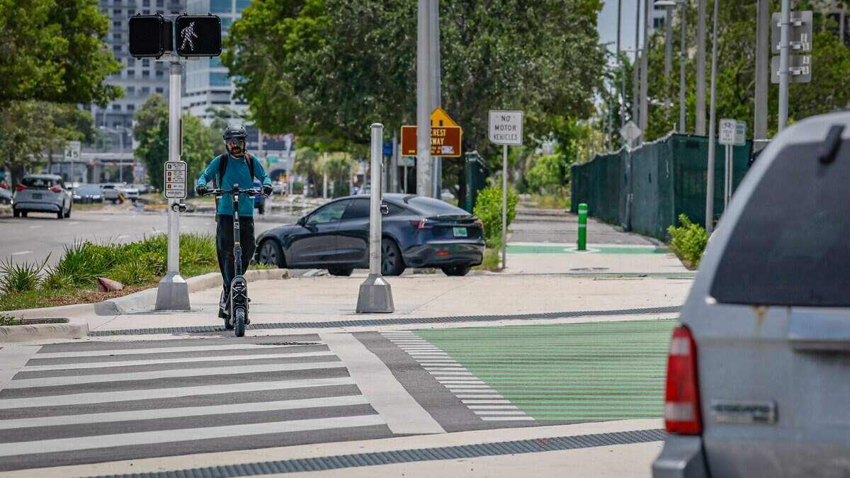 A motorized scooter crosses the intersection at US1 and SW 88th Street in Segment 9 of The Underline on Tuesday, July 14, 2026 in Miami, Florida. The southernmost 7.36-mile phase extends from SW 65th Avenue to the Dadeland South Metrorail Station.