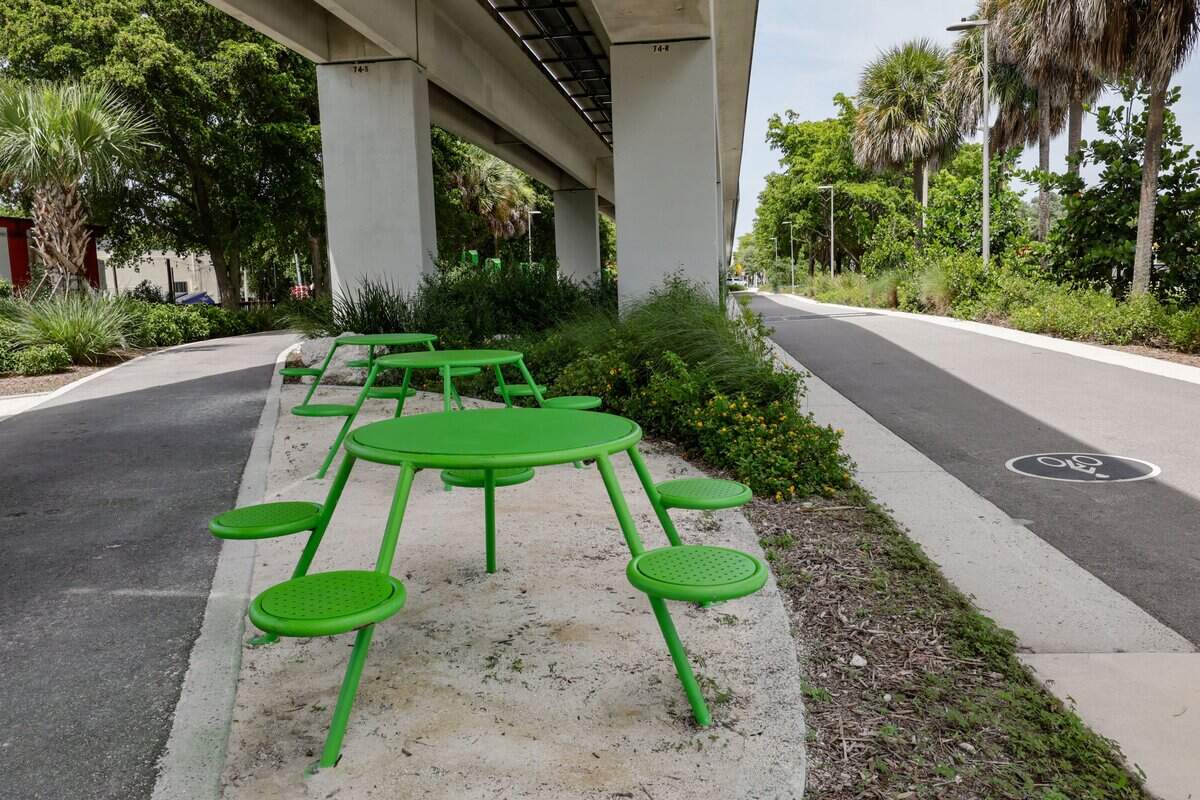 A sitting areas on the pedestrian and bike trail sorrounded by native pollinator plants and bird houses along Mariposa Gardens at Segment 9 of The Underline on Tuesday, July 14, 2026 in Miami, Florida. The southernmost 7.36-mile phase extends from SW 65th Avenue to the Dadeland South Metrorail Station.