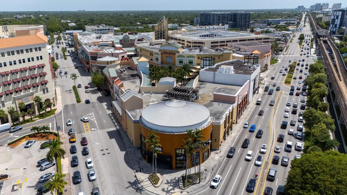 Exterior view of The Shops at Sunset Place on Wednesday, July 15, 2026, in South Miami, Florida. The Shops at Sunset Place in South Miami will be demolished to make way for a new development featuring residential towers, a hotel, offices, a theater and restaurants.