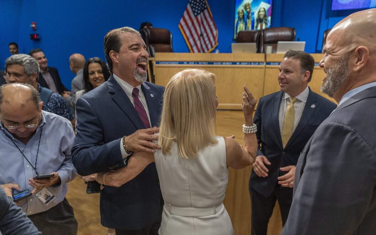 Miami Dade School Board members congratulate Rafael Villalobos after he was selected as the new Miami Dade County Public School superintendent.